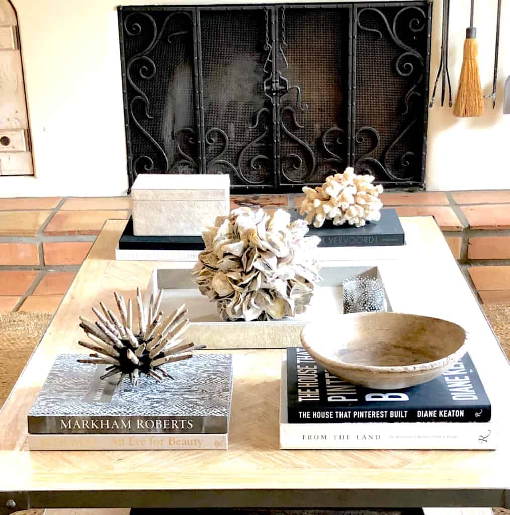 neutral coffee table decor with elements from the sea