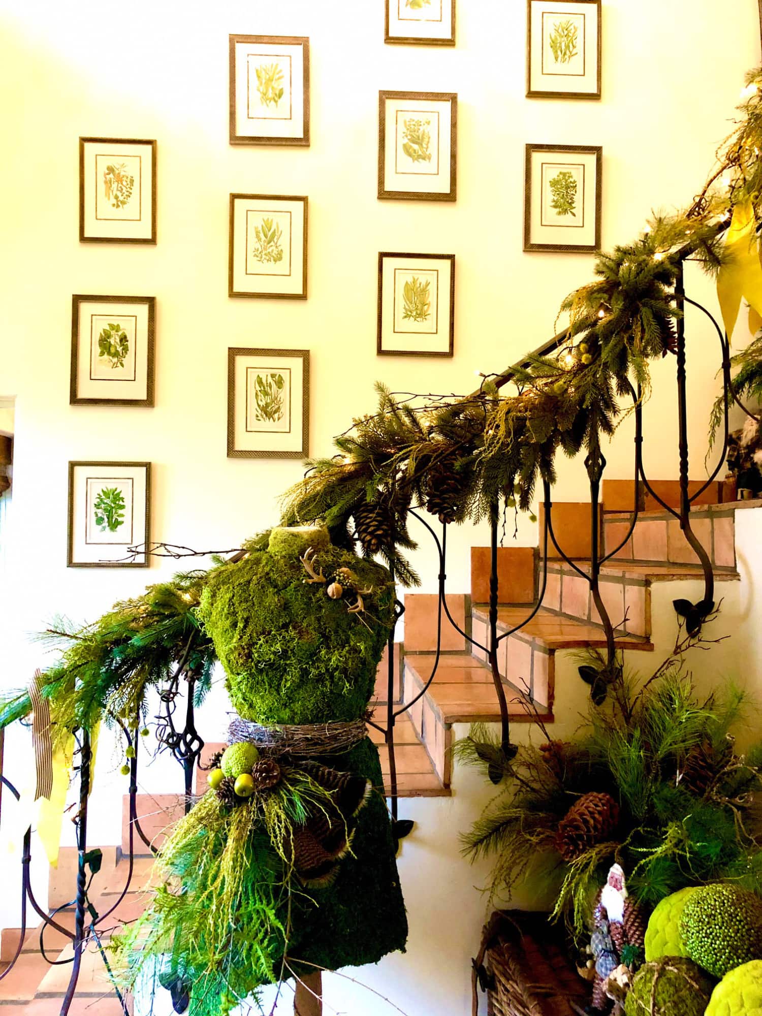 christmas mannequin with gallery wall