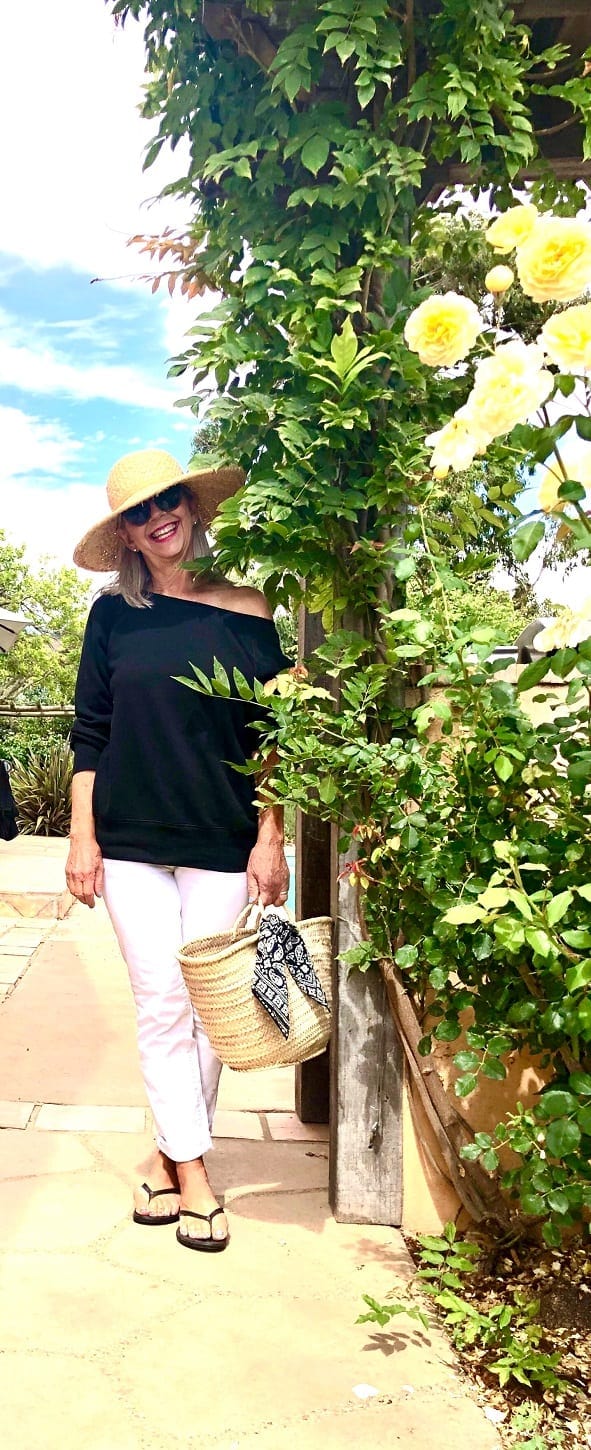 Over 50 Fashion Blogger Cindy Hattersley in off the shoulder top and boyfriend jeans