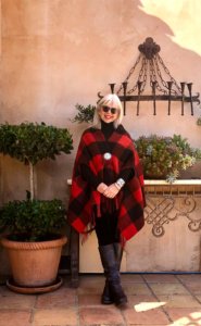 CINDY HATTERSLEY IN EILEEN FISHER LEGGINGS AND RED AND BLACK PONCHO