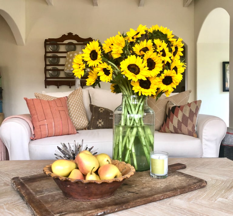 cindy hattersley's coffee table with sunflowers and pears