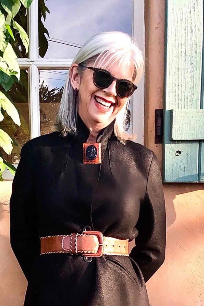 black blazer and vintage celluloid brooch