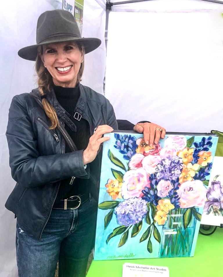 artist heidi woodmansee with painting