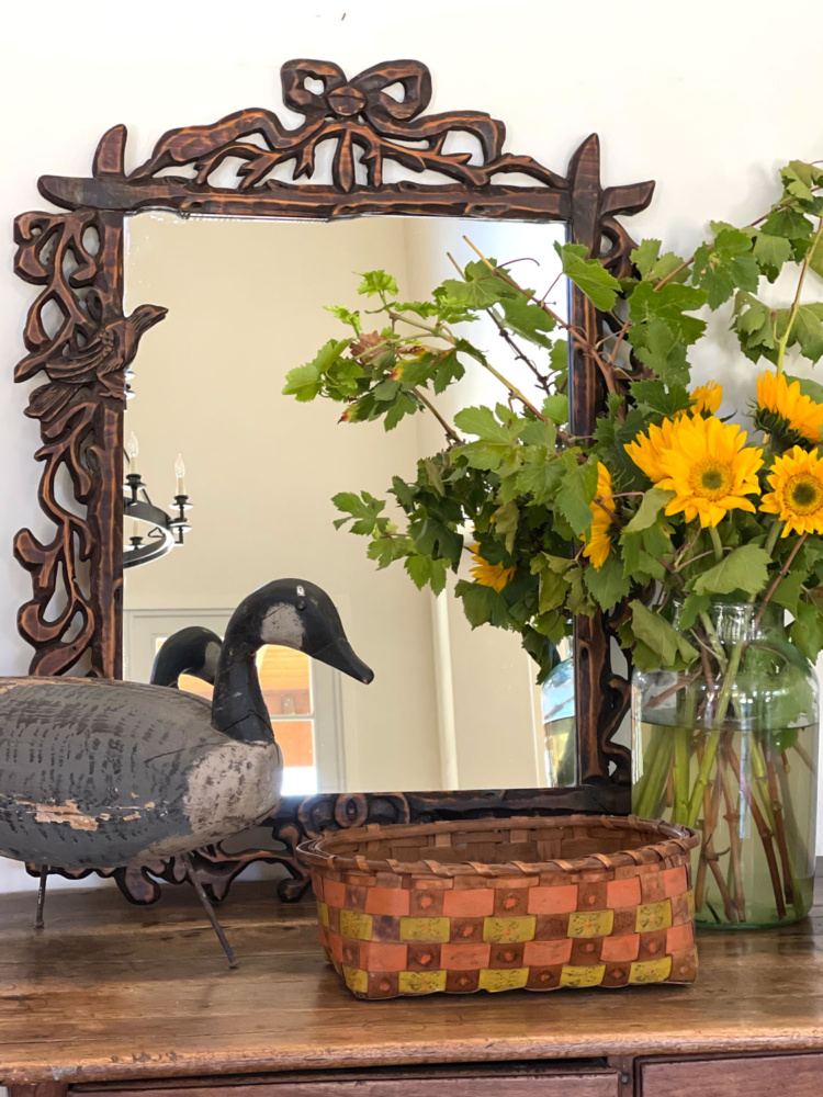 cindy hattersley antque table with sunflowers and vintage goose decoy