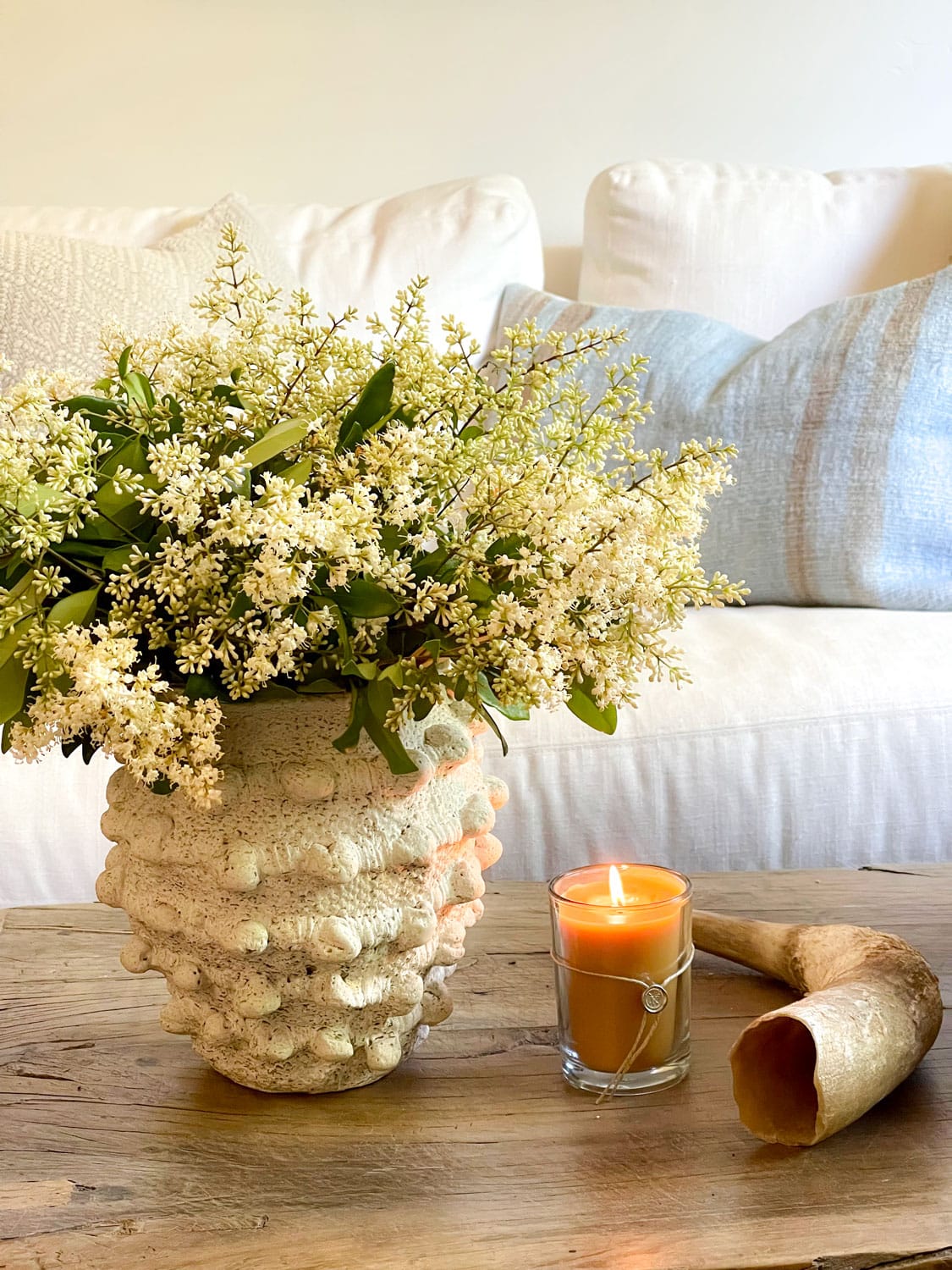 cindy hattersleys den with candle & flowers