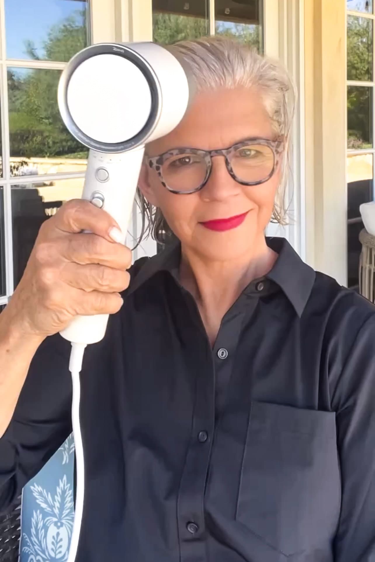 woman with silver hair using zuvi hairdryer