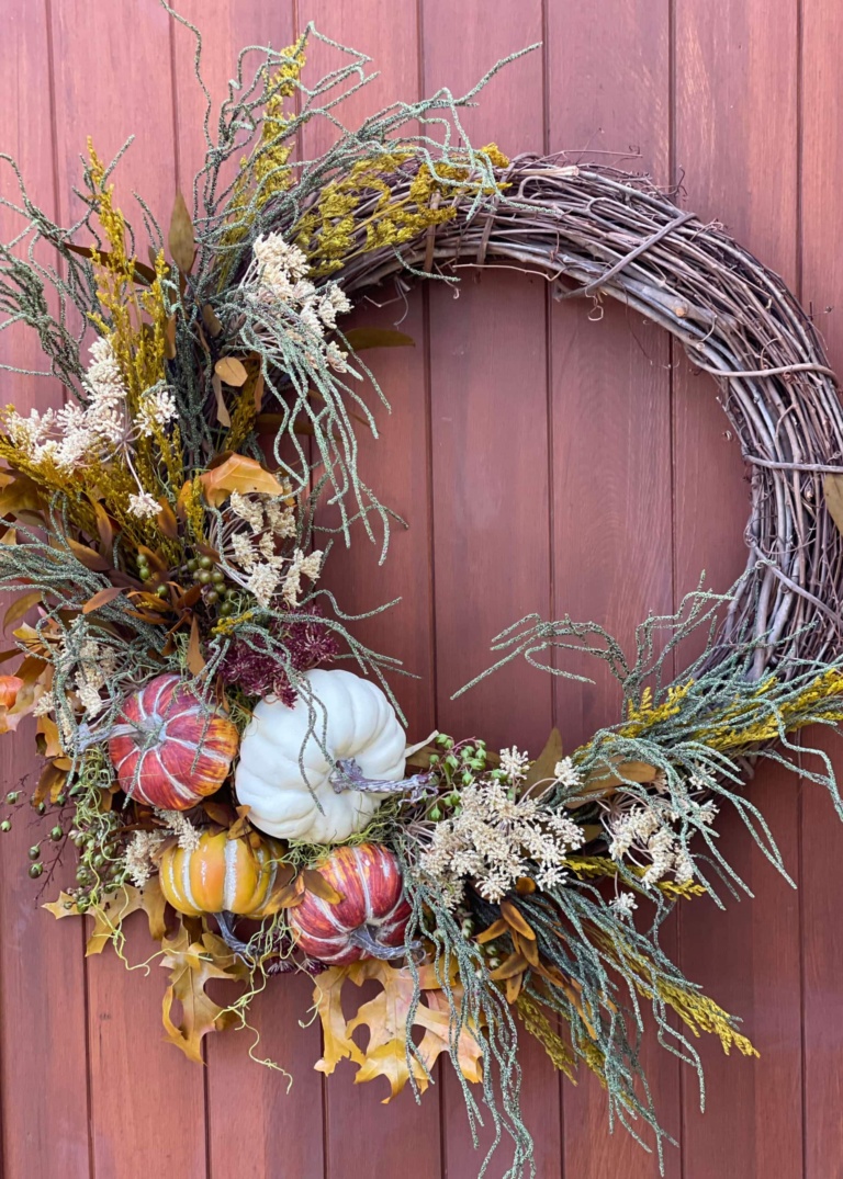 fall wreath with faux pumpkins