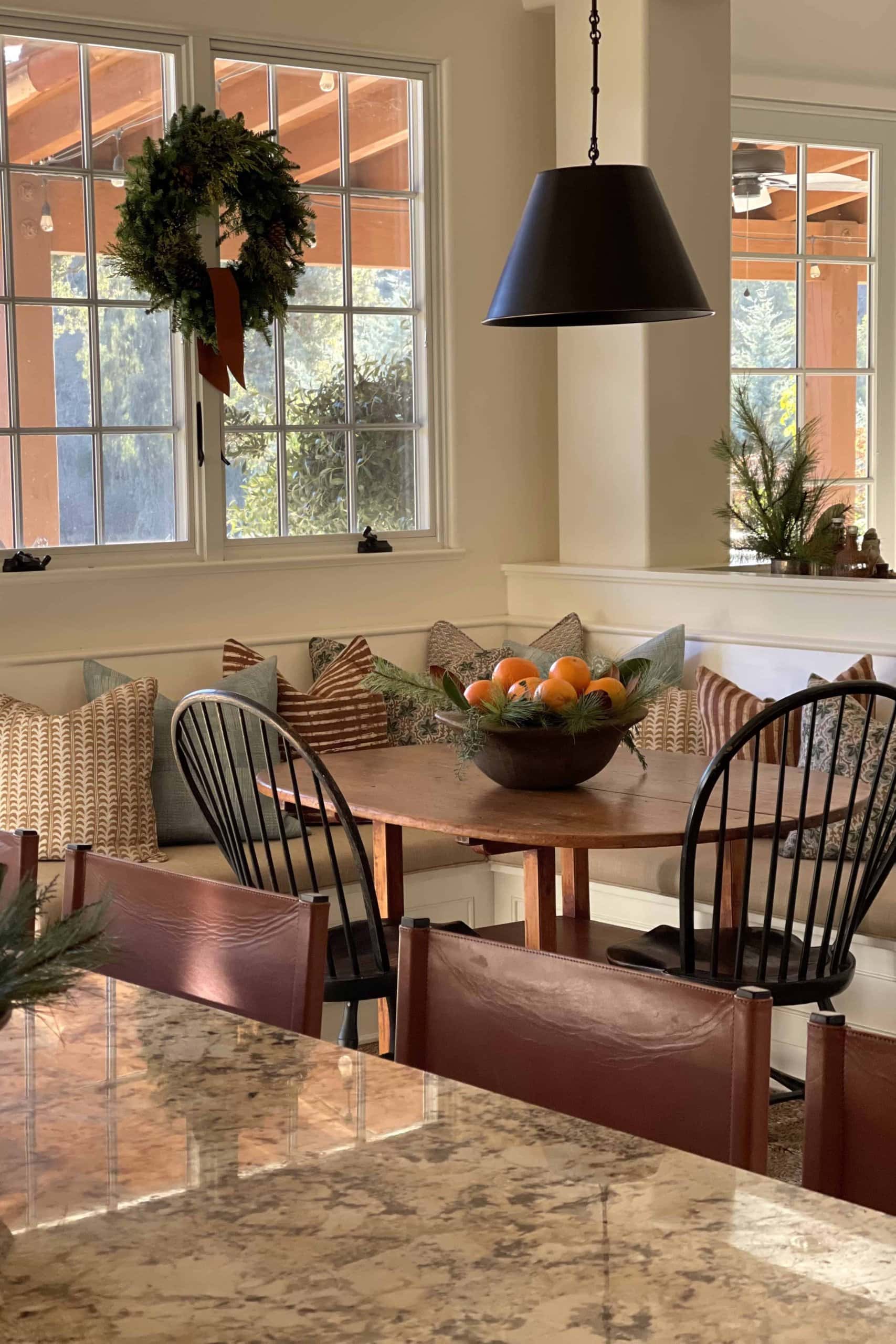 banquette with bowl of oranges 