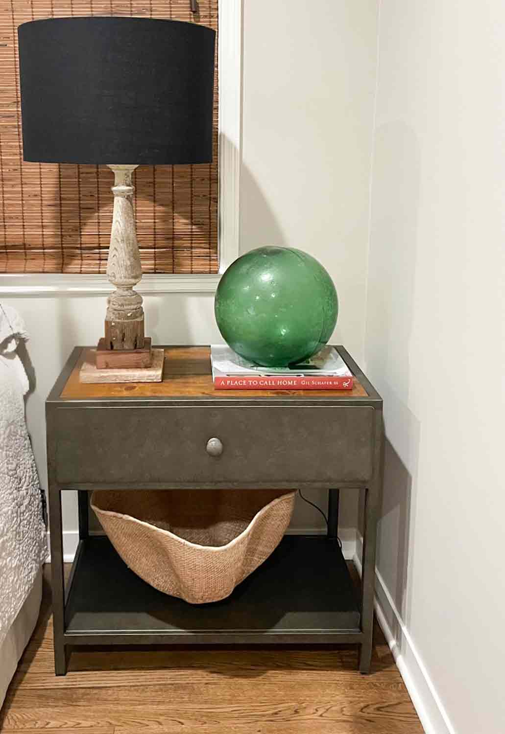 bedside table with lamp and basket