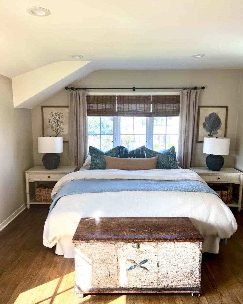 Primary bedroom with bed in front of window