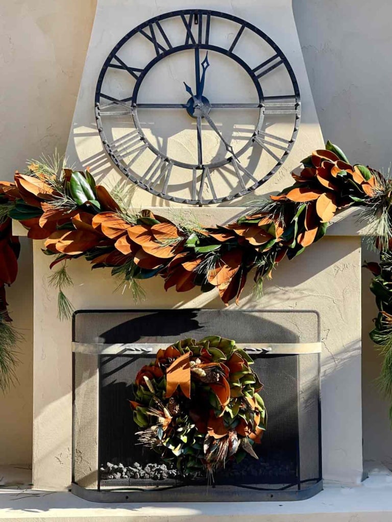 COURTYARD FIREPLACE WITH MAGNOLIA WREATH AND GARLAND