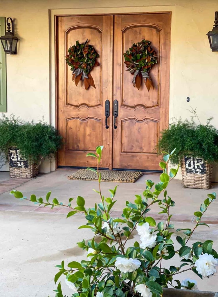 front doors with magnolia wraths