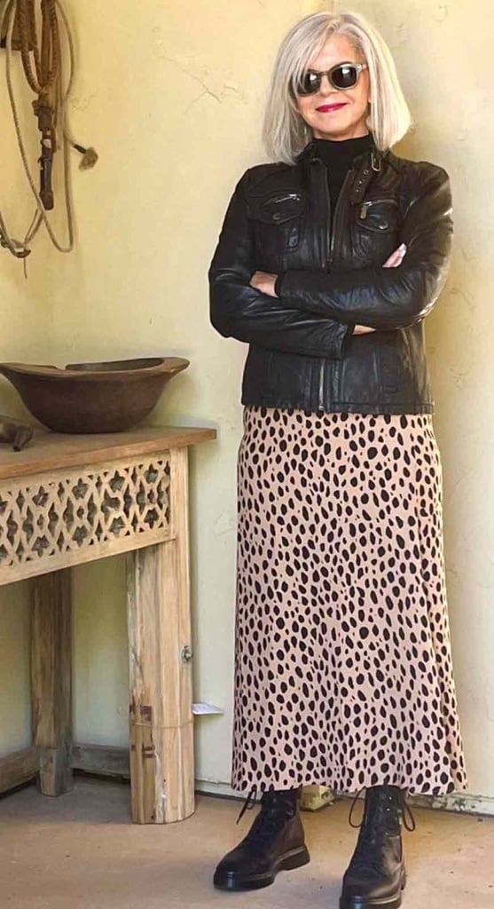 leopard skirt black moto jacket combat boots gray haired woman