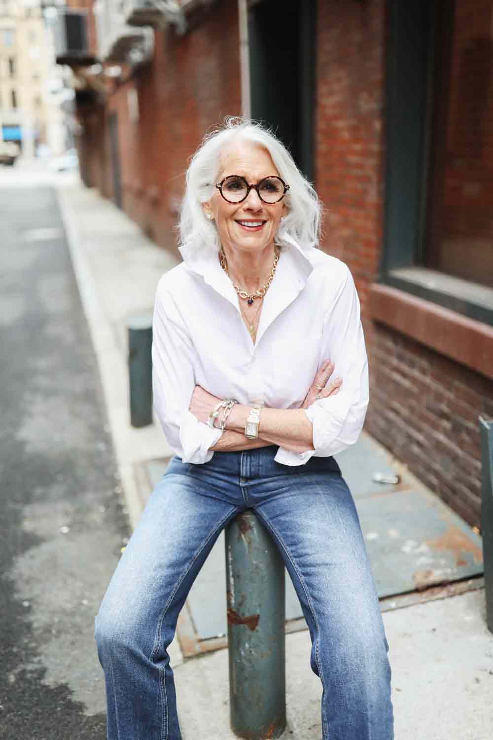 Cheryl Sparks-IG Instagram Silver Haired Beauty in Jeans and white shirt