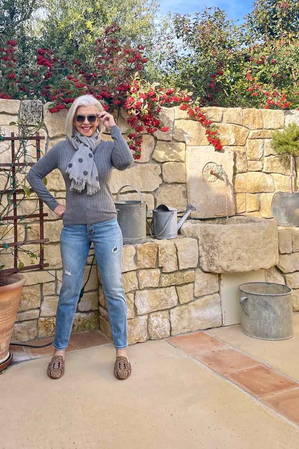 Distressed Jeans and gray turtleneck & scarf-The Absolute Best Ways to Wear Jeans Over 50 and Feel Confident