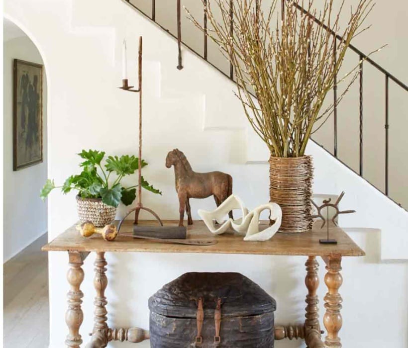 Richard Halberg designed foyer with console table and artifacts
