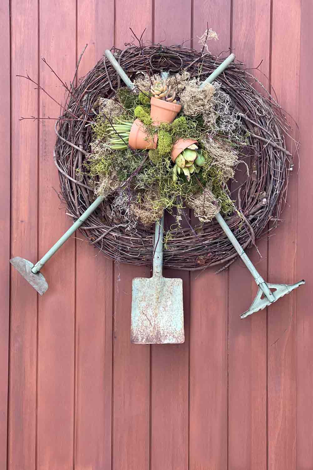 grapevine wreath with garden tools