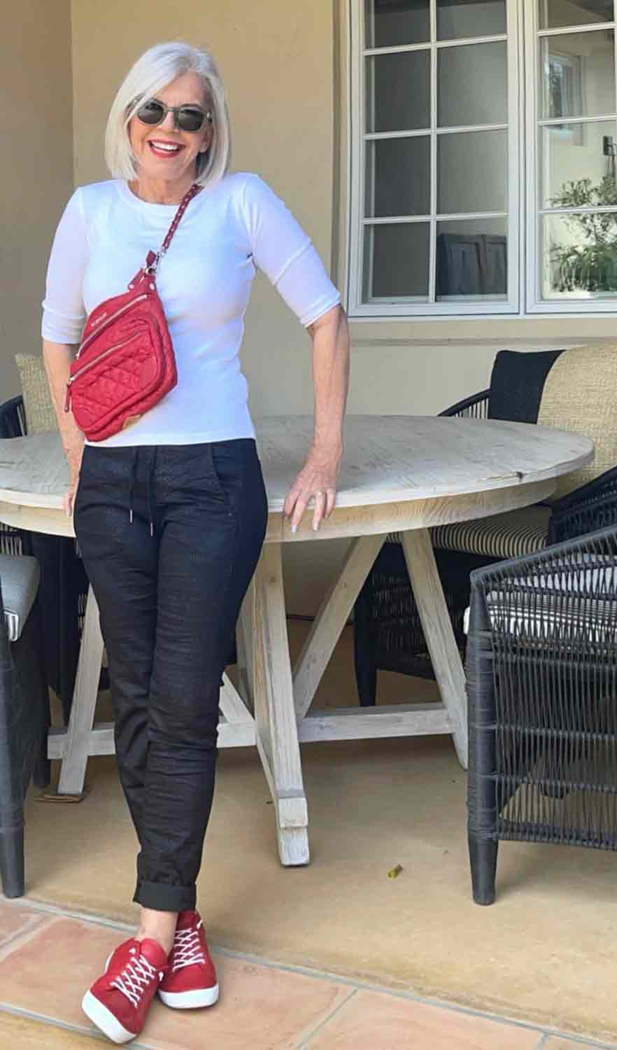 black cargo pants, mz wallace bag white shirt | Chic Sneaker Styles that Women Over 50 can Actually Wear