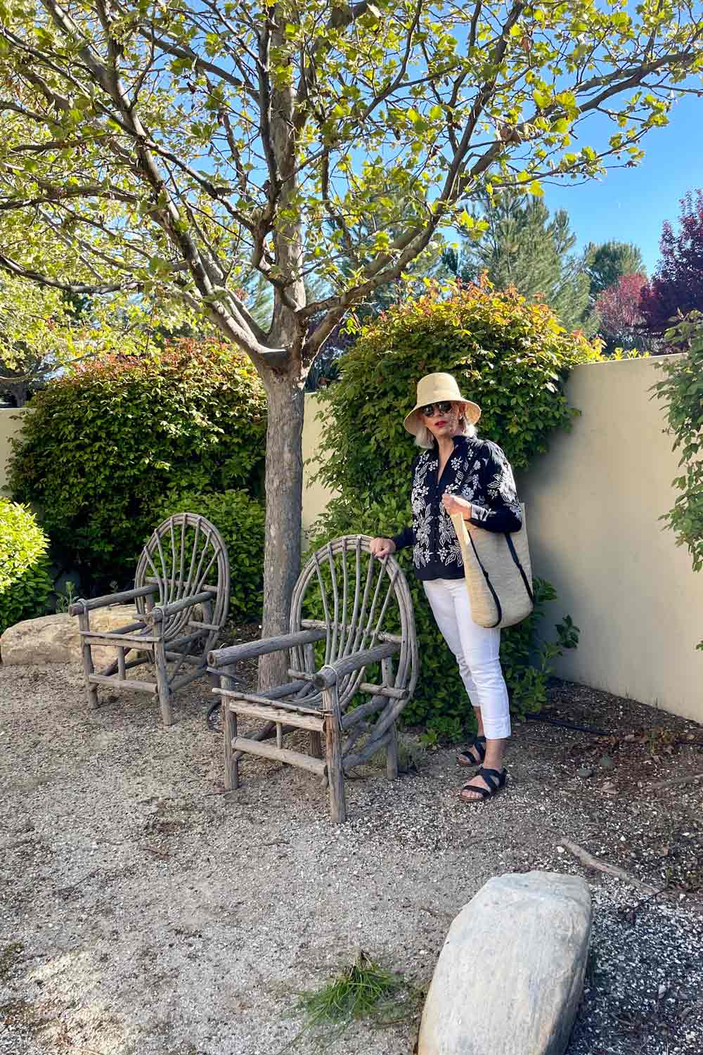 White jeans outfit women over 50 White jeans and Anthro Tavi Blouse black and white