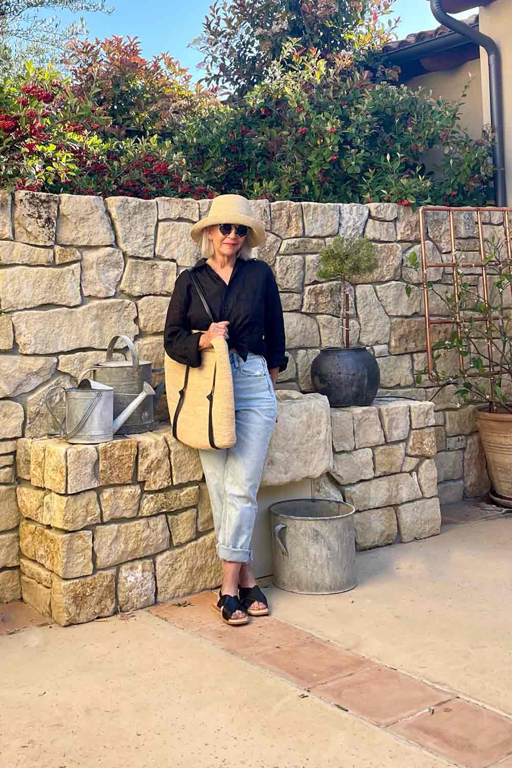black linen shirt with H&M jeans and janessa leone straw accessories