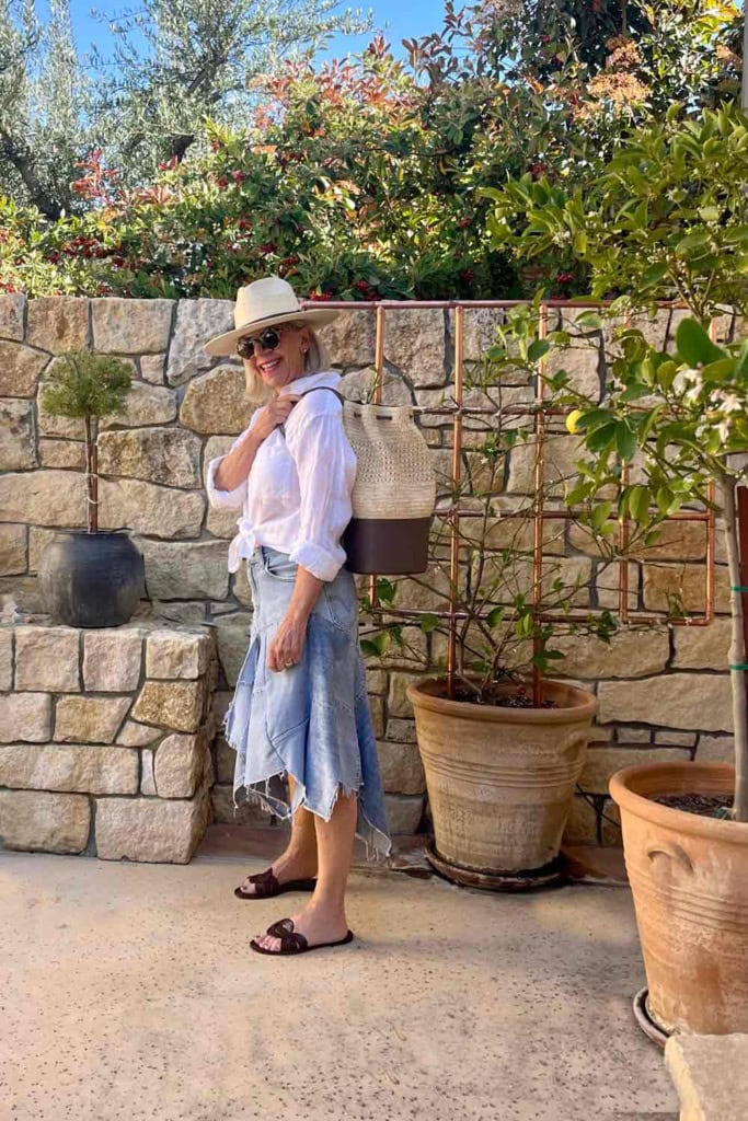 Patchwork Jean Skirt, linen shirt, sandals, a straw bag and hat.
