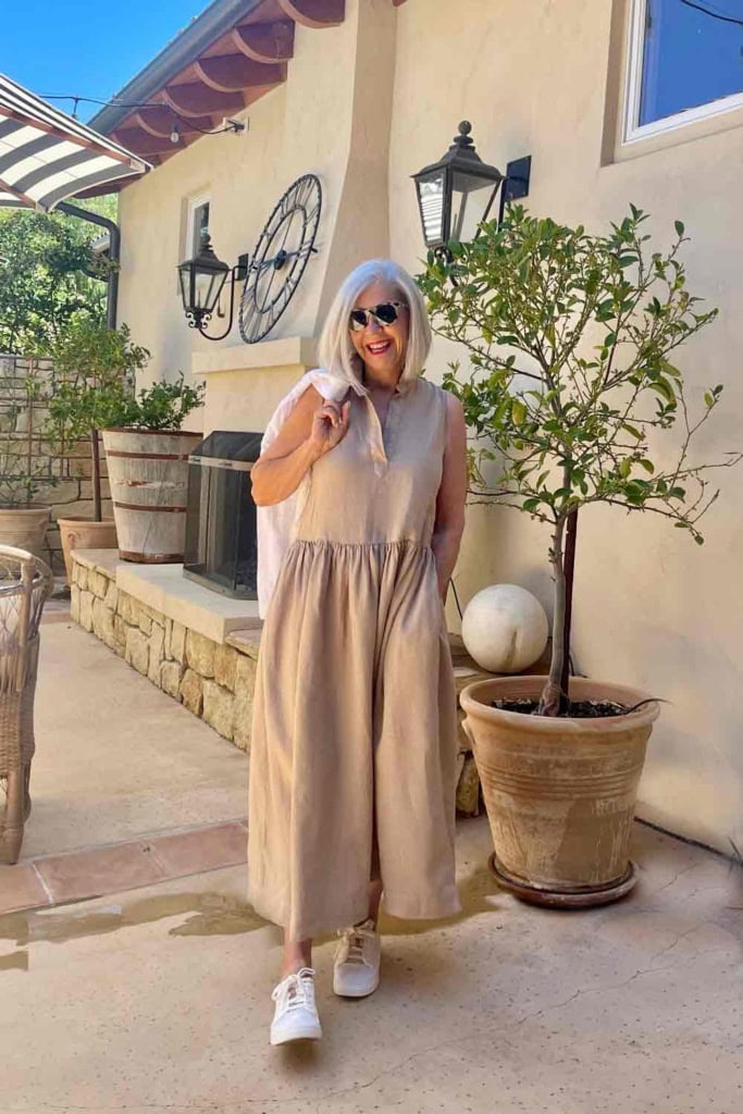 Gray haired woman in sleeveless khaki dress-cindy hattersley