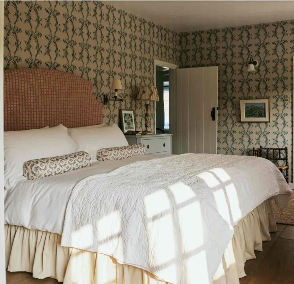 Lucy Cunningham's Hampshire Bedroom with green and white wallpaper and white linens