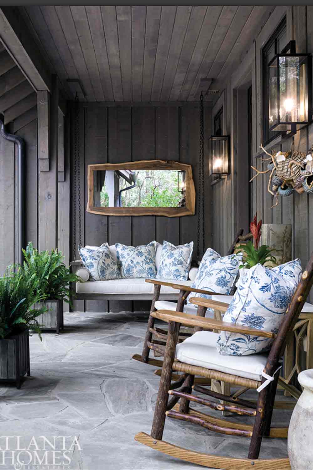 Cozy Porch with blue and white pillows designed by DWH Interiors 