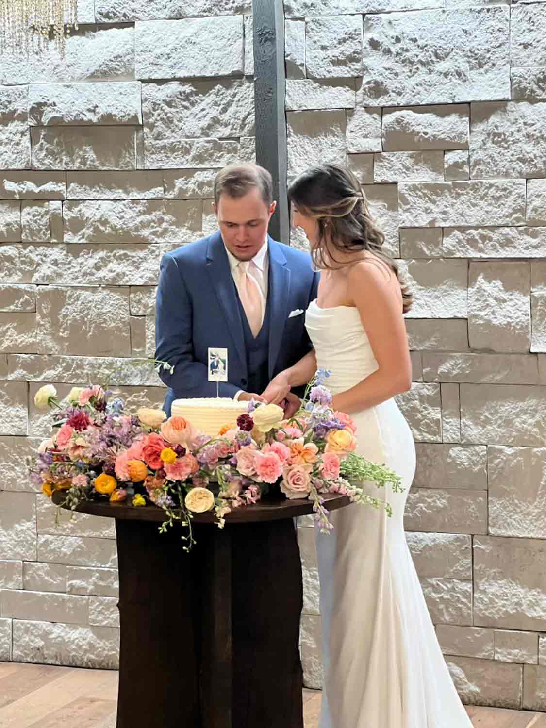 bride and groom cutting their cake
