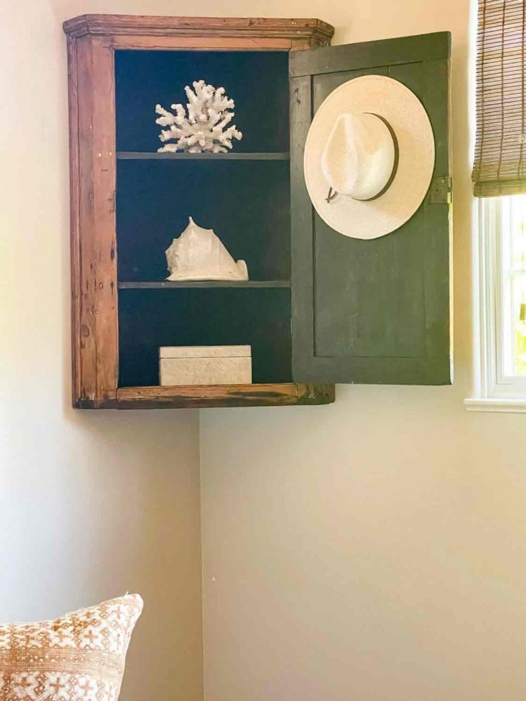 antique hanging cornter cupboard with summer decor