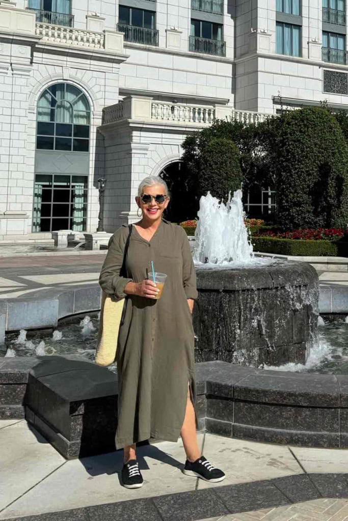 cindy hattersley in green gauze maxi dress in front of fountain Grand American Hotel