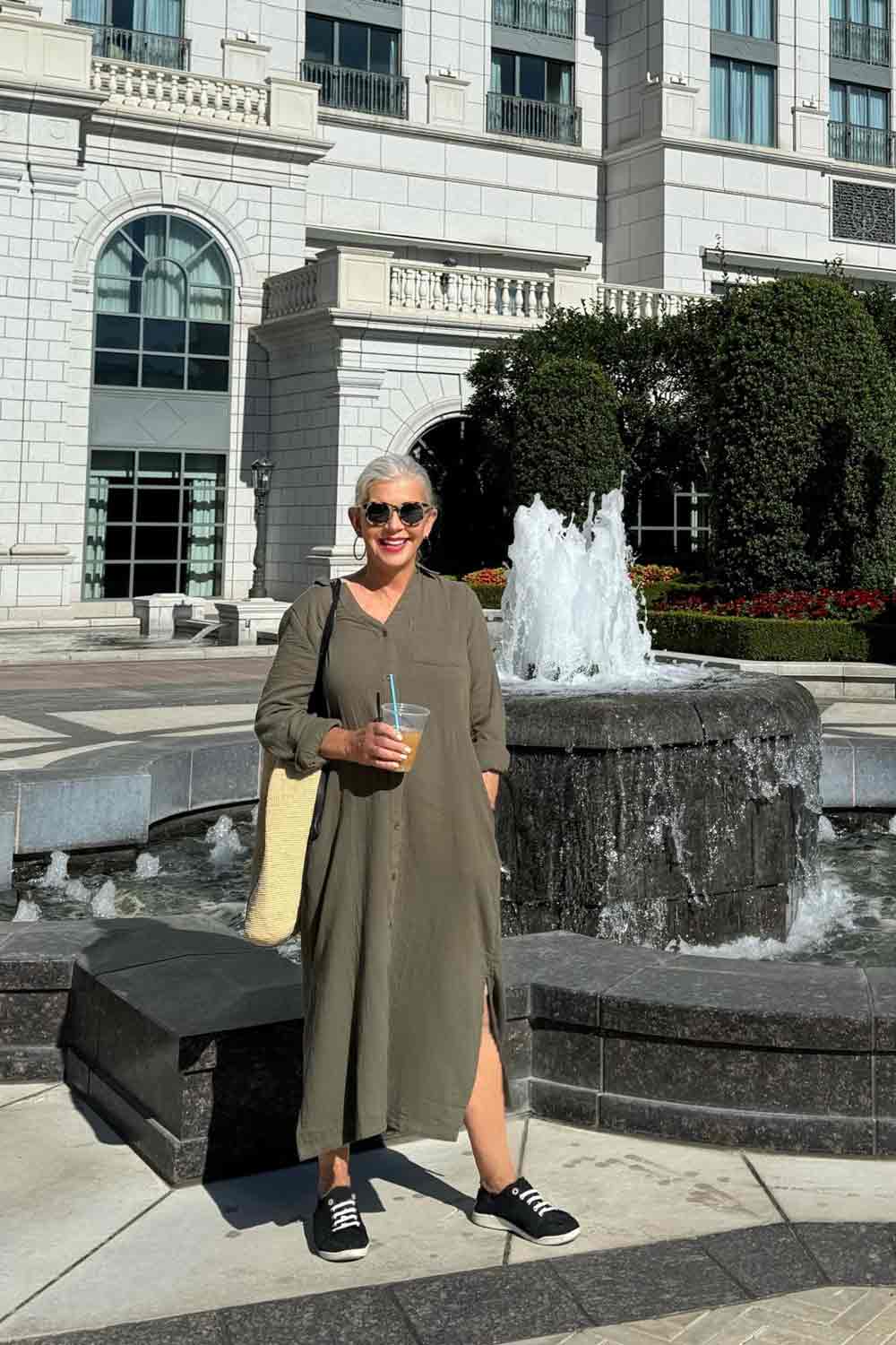 cindy hattersley in green gauze maxi dress in front of fountain Grand American Hotel