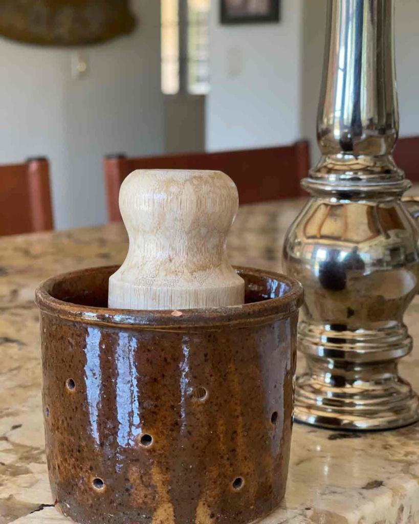 Scrub brush and vintage french cheese mold