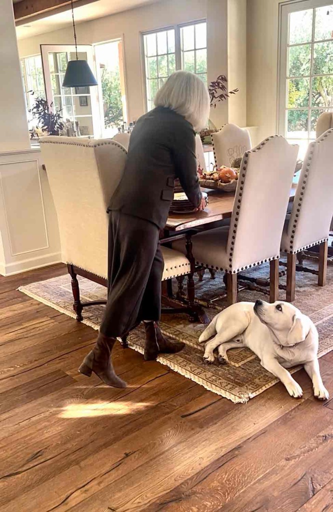 cindy hattersley setting the table with her dog Scout