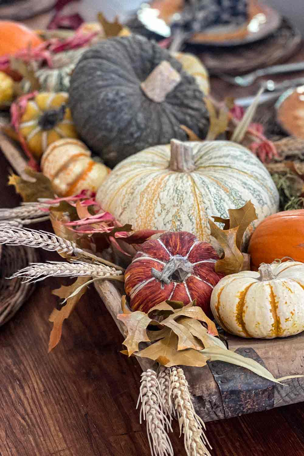 dough bowl filled with pumpkins