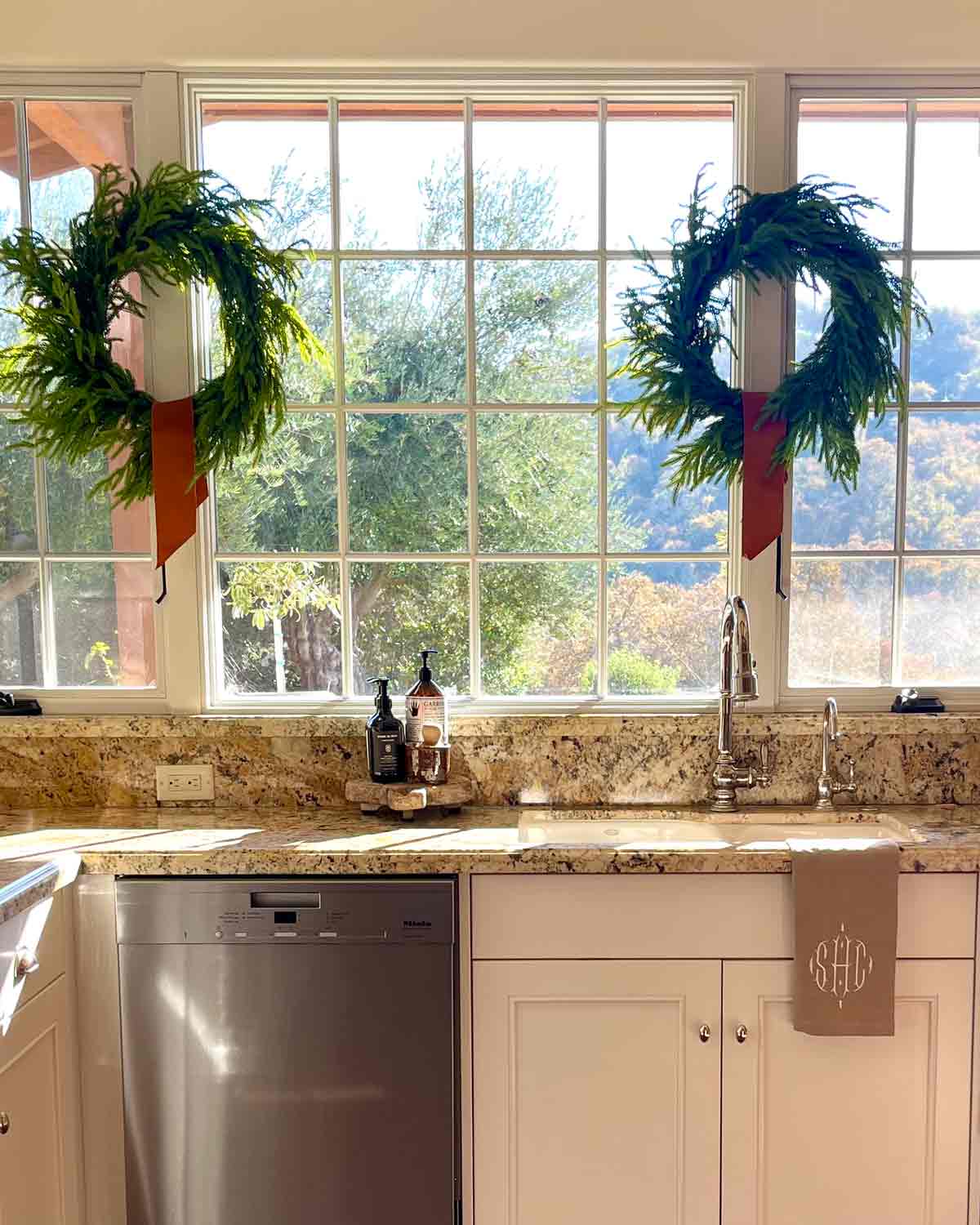 norfolk pine wreaths in kitchen windows