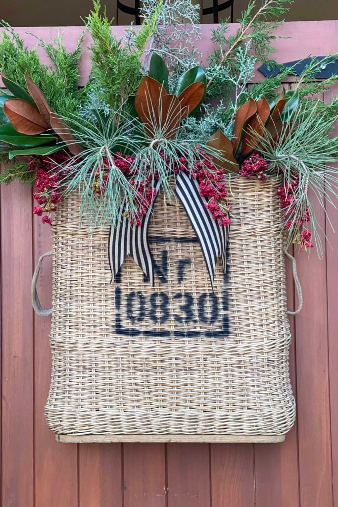 Vintage Artillary Basket filled with greens, magnolia and faux berries-Cindy Hattersley Design