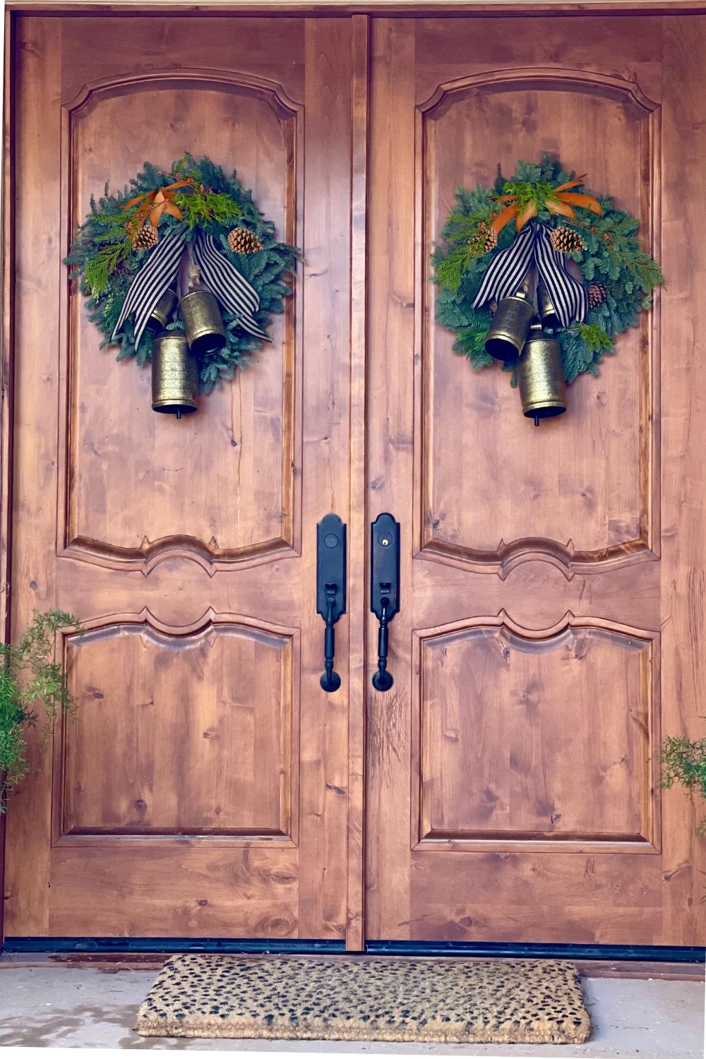 Front doors with wreaths and bells