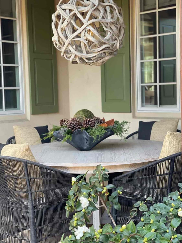 outdoor dining table with zinc bowl  with greens