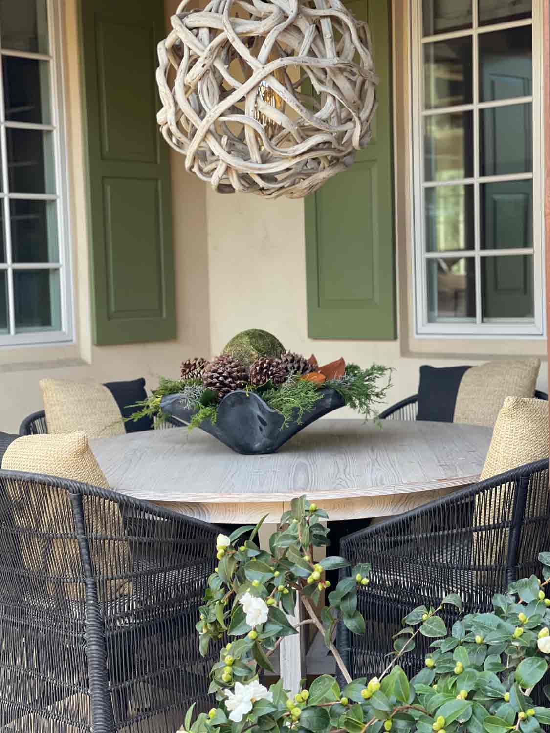 outdoor dining table with zinc bowl  with greens