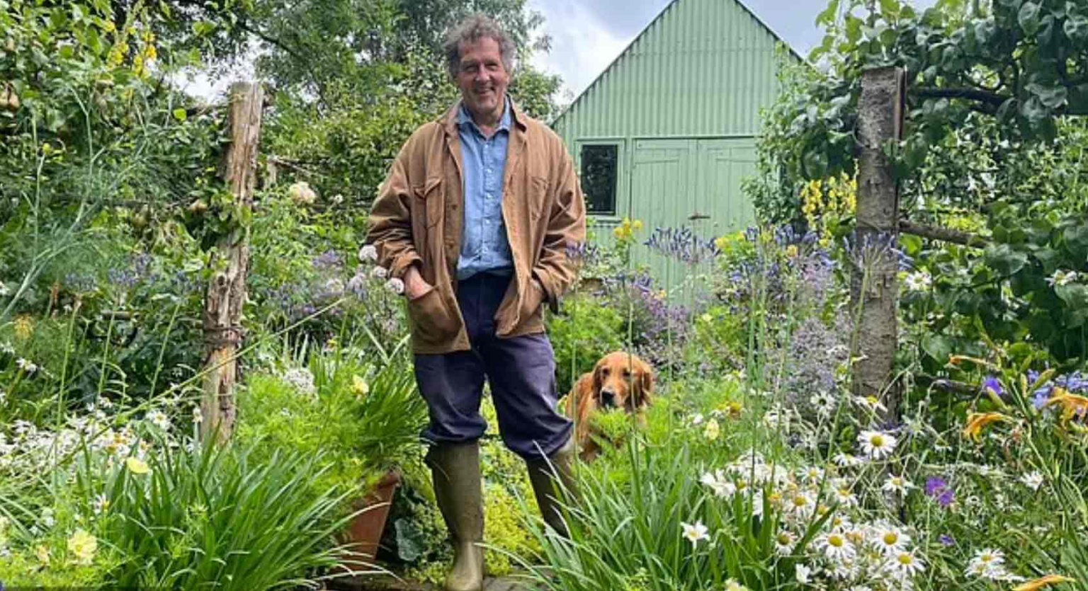 Monty Don and his dog in his garden