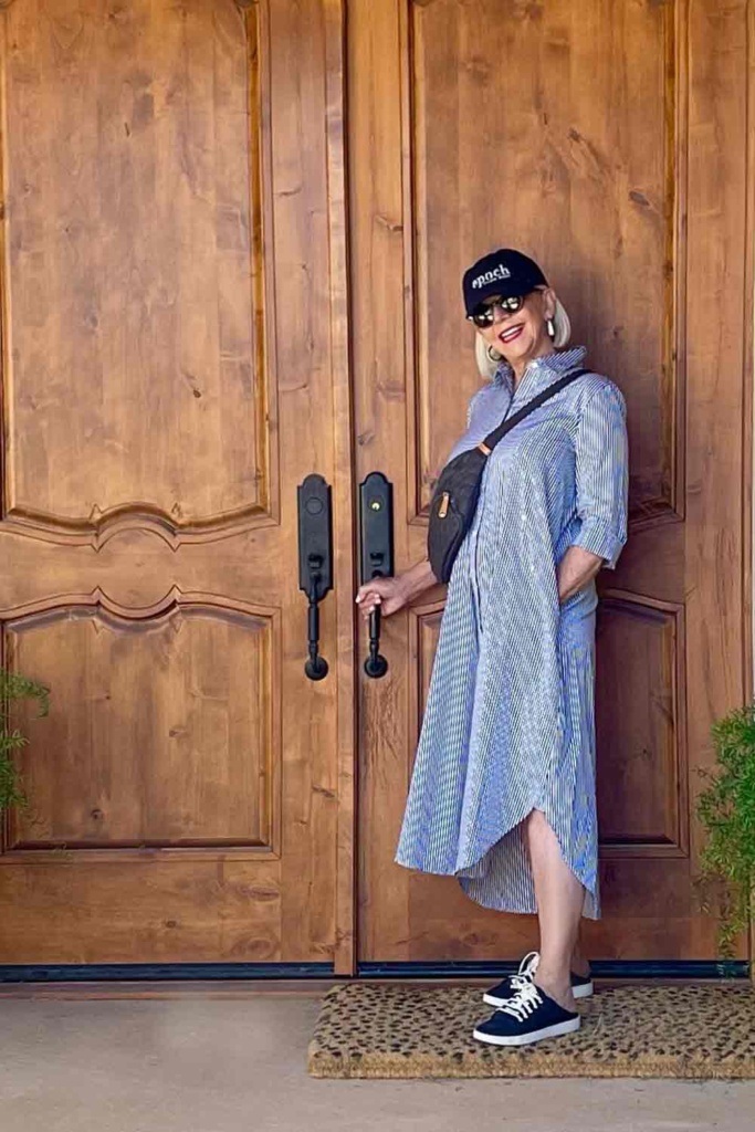 BR Shirt Dress with black crossbody and baseball cap