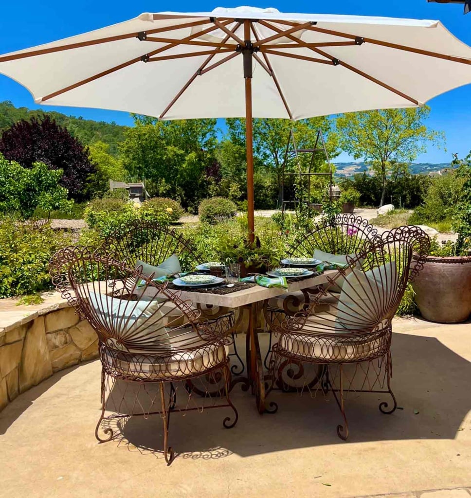 iron outdoor table with umbrella