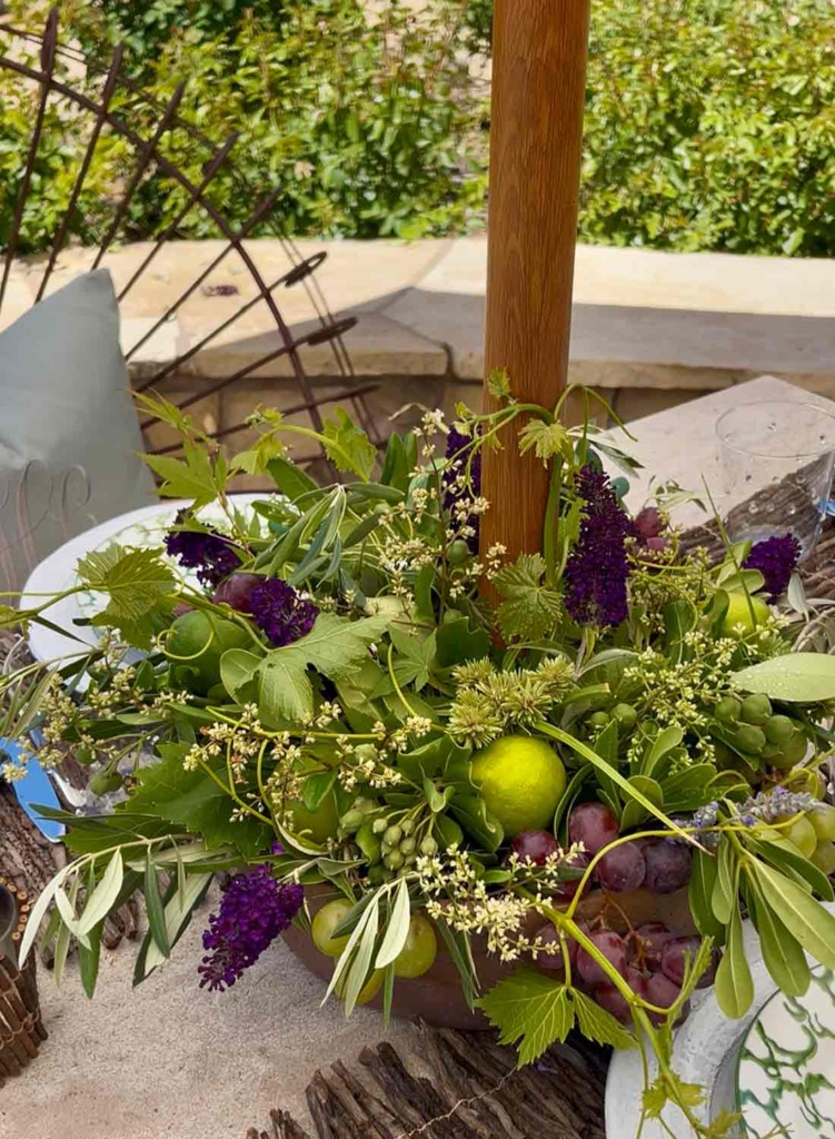 centerpiece of greens, limes and grapes