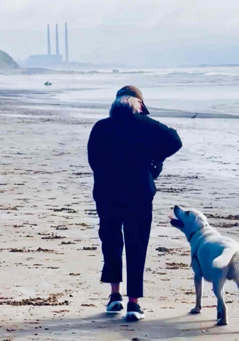 cindy hattersley and her dog Scout at the beach