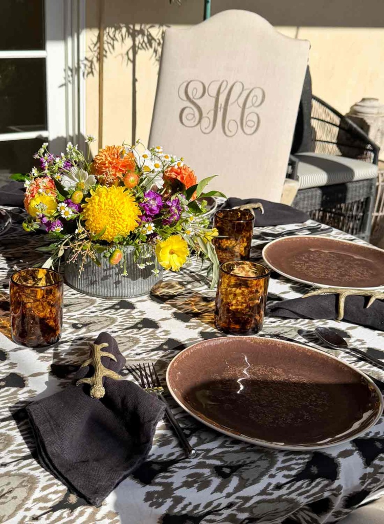 courtyard table setting with monogrammed dining chairs