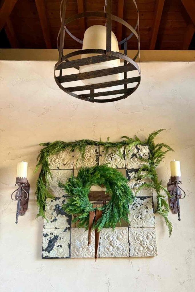 Mirror courtyard entry dressed with Christmas greens