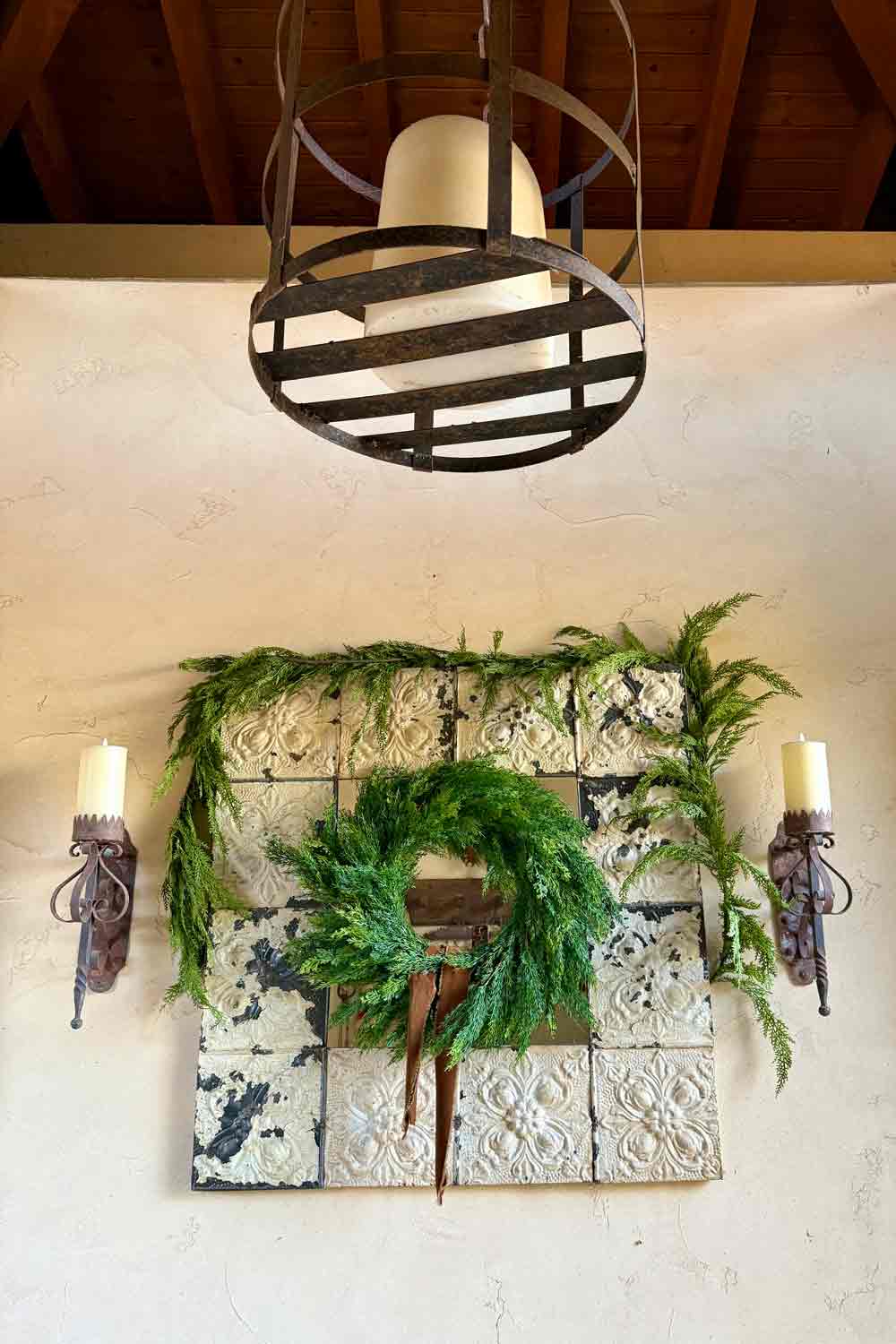 Mirror courtyard entry dressed with Christmas greens