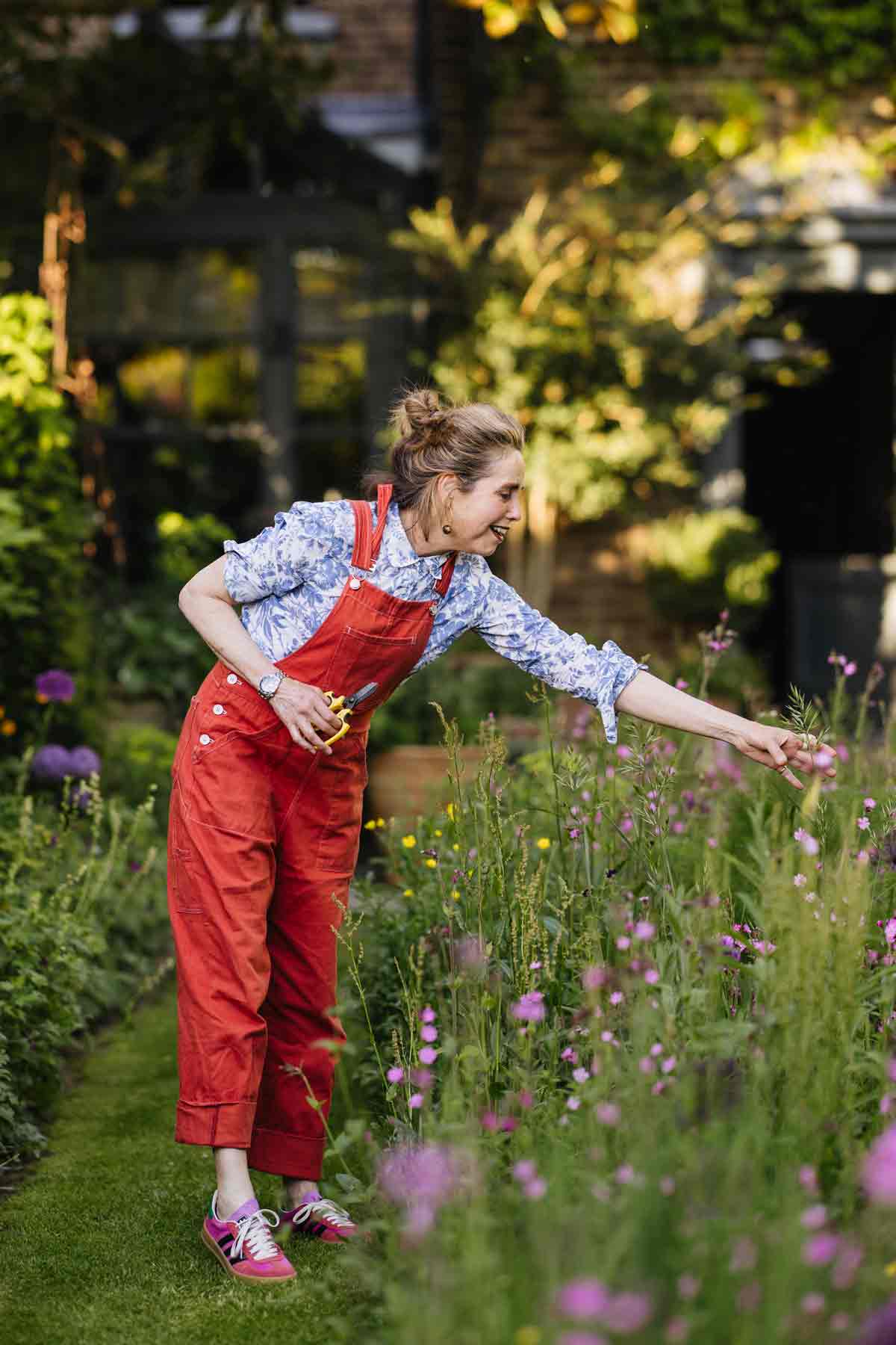 Butter Wakefield tending her garden