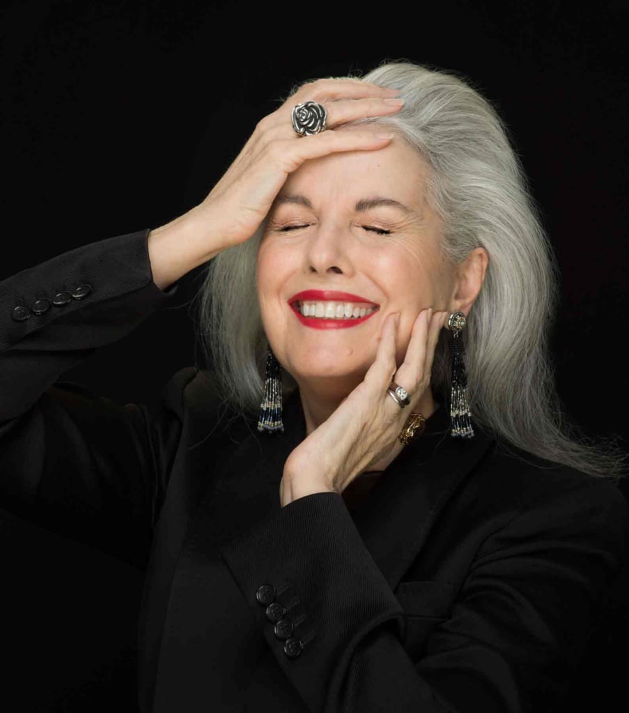 Kerry-Lou Henson, silver hair expert and founder of Silver Style Studio in black sweater